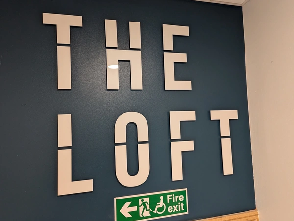 The Loft 5mm Acrylic logo on stand offs - finished install