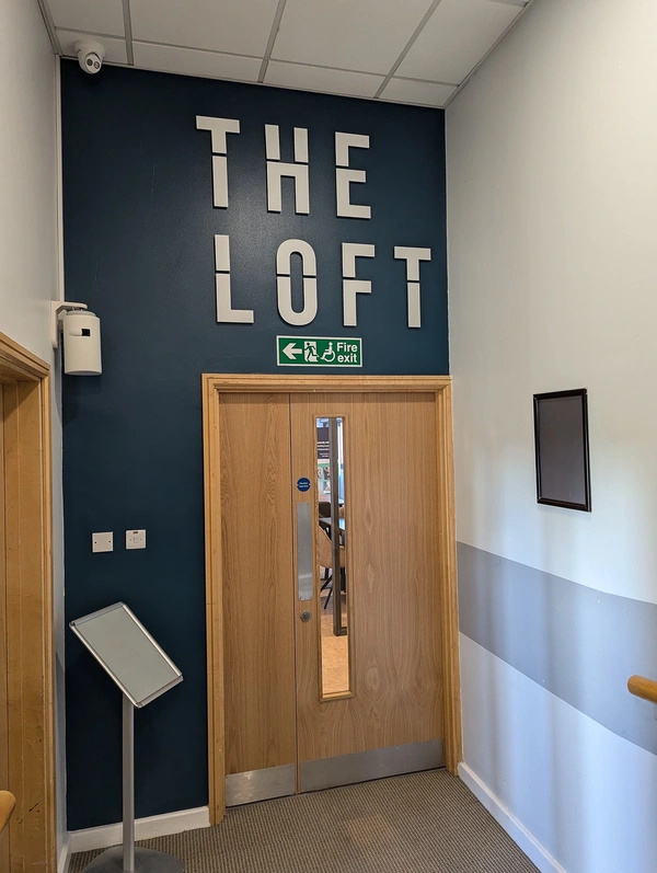 The Loft 5mm Acrylic logo on stand offs - finished install